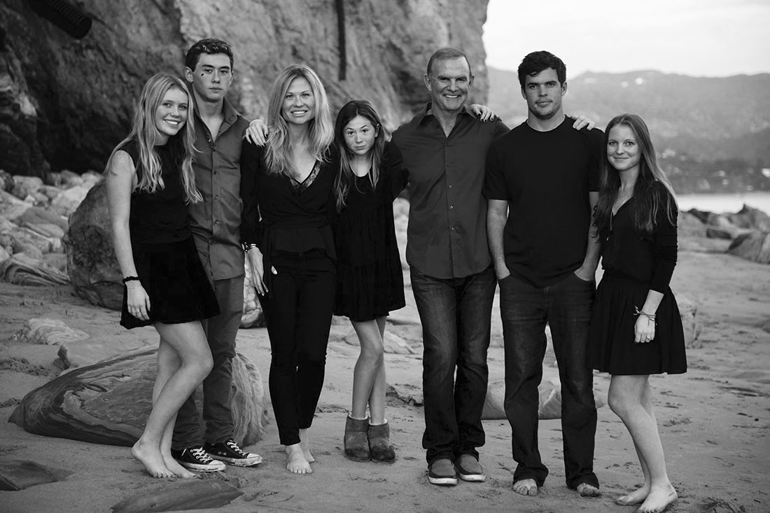 a Strange Family portrait in black and white taken at the beach